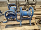 a blue hose sitting on a pallet in a warehouse