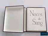 a book with writing on it sitting in a box