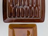 two brown trays with forks and spoons on them