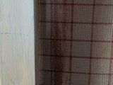 a close up of a window with a curtain in it