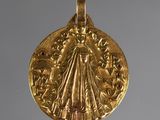l'image d'une pièce d'or sur laquelle figure une femme