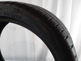 a close up of a tire on a white surface
