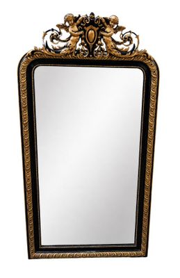 a black and gold mirror with a decorative design on it