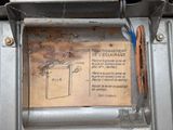 a piece of paper taped to the side of a stove