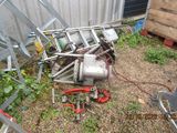 a pile of junk on the ground next to a building