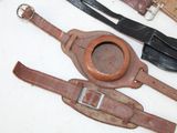 three different types of leather belts on a table