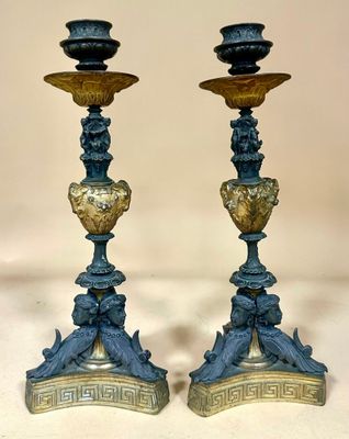 pair of blue and gold candlesticks with birds on them