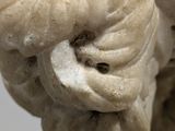 a statue of a woman with a flower in her hair