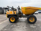 a large yellow dump truck parked in a parking lot