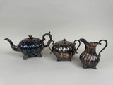 three silverplated teapots and two silverplated teapots