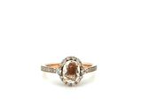a close up of a diamond ring on a white background