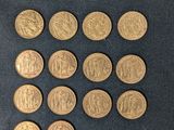 six different types of gold coins on a black surface