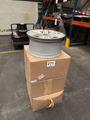 a stack of boxes with a wheel on top of it