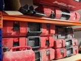 many different tools on the shelves in the garage