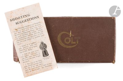 an old book with a tag on it sitting next to a bookmark