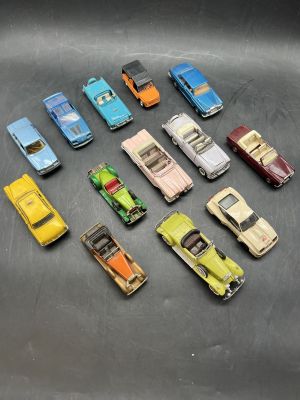 a lot of toy cars that are sitting on a table