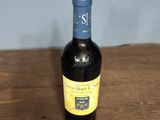 a bottle of wine that is sitting on a table
