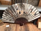 a fan that is sitting on the floor in a room