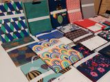 many different types of ties on display on a table