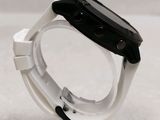 a close up of a smart watch on a plastic stand
