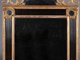 an ornate gold framed mirror with a lion head on top of it