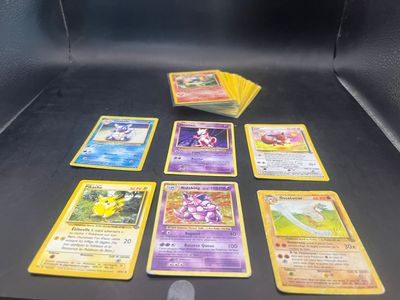 a lot of pokemon cards on the table