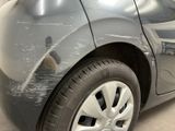 a close up of a car ' s paint job on the side of the car