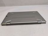 a laptop that is sitting on a white surface