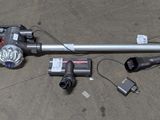 a corded vacuum that is laying on the ground
