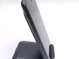a cell phone that is sitting on top of a stand