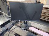 a computer monitor sitting on top of a wooden pallet