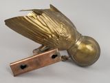 a bird that is sitting on top of a piece of metal