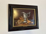 a picture of a painting of a silver pitcher and nuts on a table