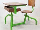 a green desk and chair with a wooden seat