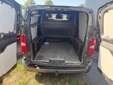 the back of a van with the door open and the cargo compartment in the back