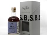 a close up of a bottle of liquor next to a box