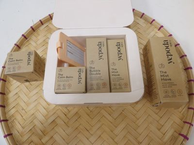 three boxes of lip bales on a tray on a table