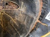 a close up of a baseball glove with a tag on it