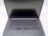 an open laptop computer sitting on top of a white table