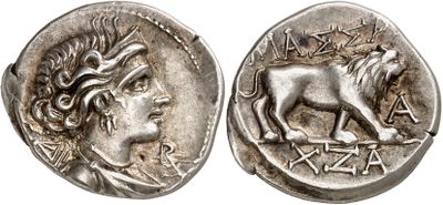 a silver coin with an image of a lion on it