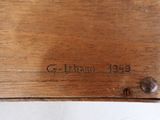 an image of a close up of a piece of wood with writing on it