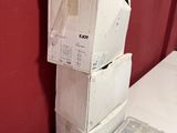 boxes stacked on top of each other in a room with a red wall