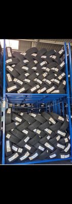 a blue cart filled with lots of black and white items
