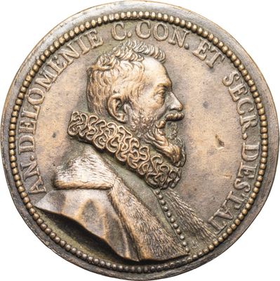 Gros plan sur une pièce de monnaie portant le visage d'un homme