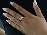 a woman with a ring on her finger and a ring on her hand