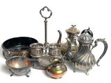 a lot of silver items that are on the table