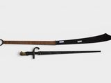 two swords with a wooden handle and a black handle