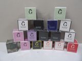 many different boxes of perfume sitting on a table