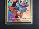 an image of a pokemon card with a girl and a penguin on it