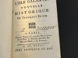 an old book with writing on it sitting on top of a table